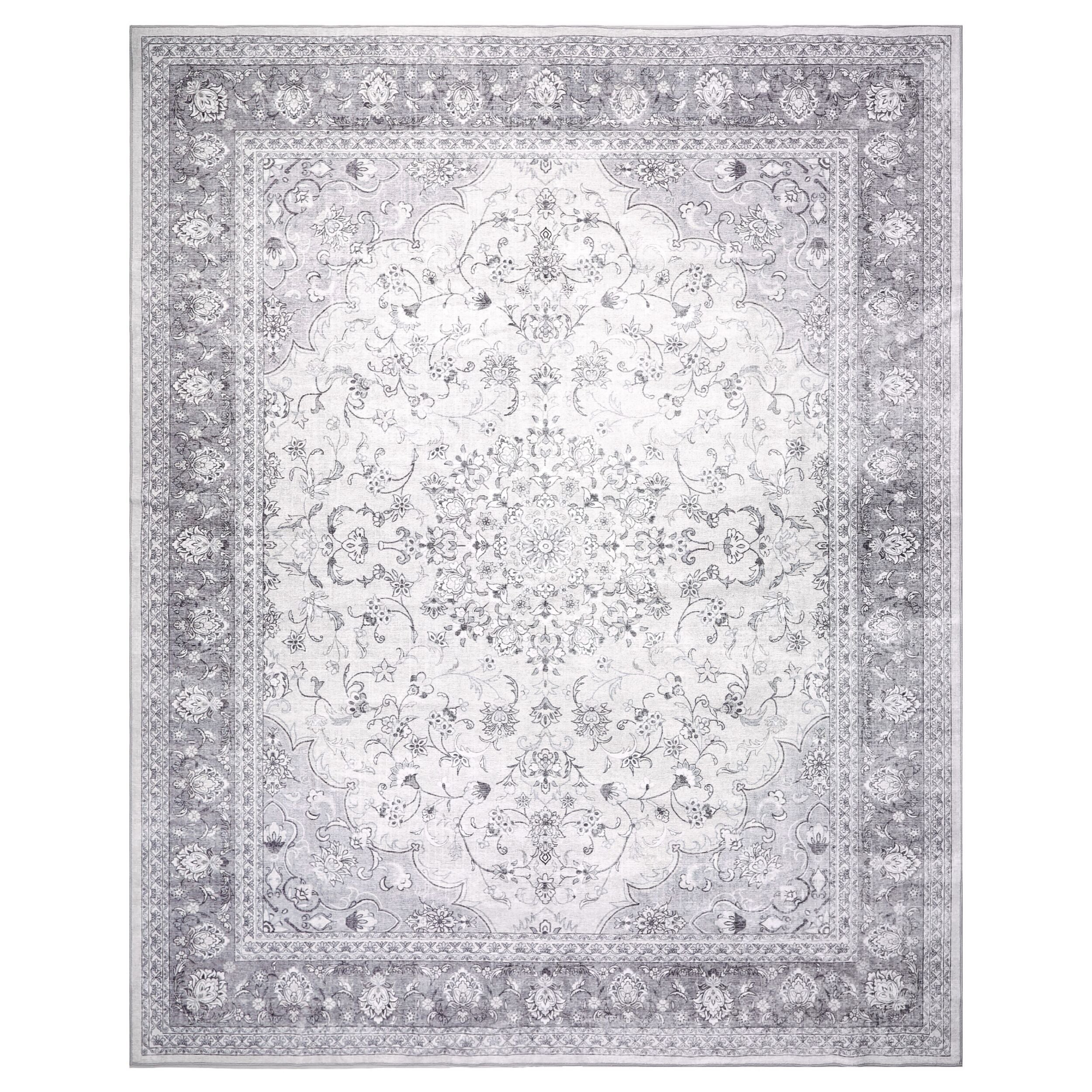 The Manisa Washable Rug 240x300cm features a rectangular Persian-inspired design with a faded floral and geometric pattern in beige, cream, and blue-green. Made from durable, machine-washable polyester for easy care.